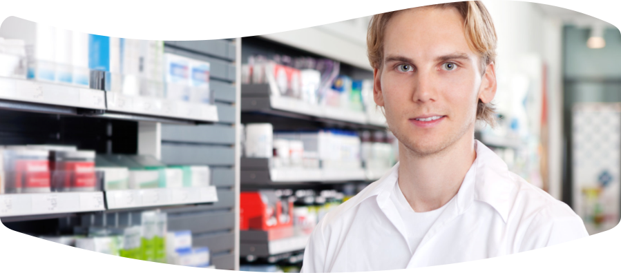 a pharmacist with boxes of medicines behind him